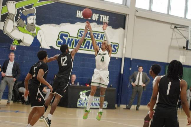 Philip Ross of SCCC launches the ball at the basket.