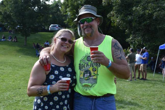 Locals smile for a photo at last year’s Beer Bash.