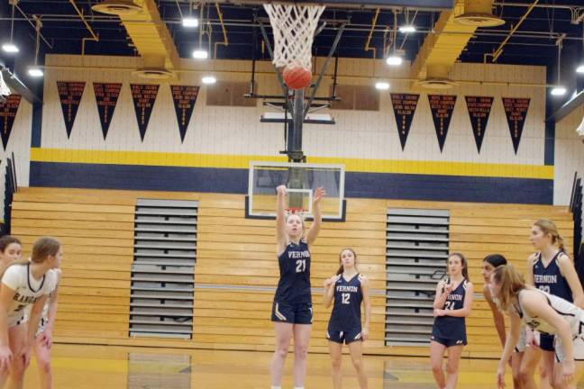Vernon's Chloe DeBonta (21) releases the ball from the foul line. She scored one point and grabbed one rebound.