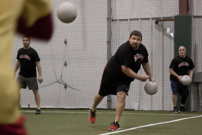 Shawn Hillenbrand, of the Ballers, hurls a dodgeball at one of the opponents.