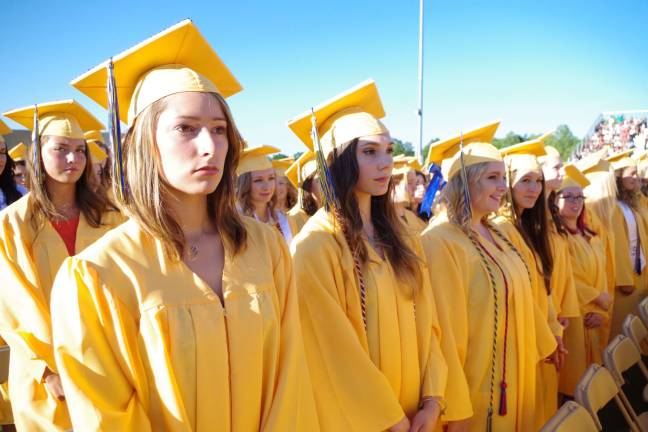 Female graduates line up at the graduation ceremony.