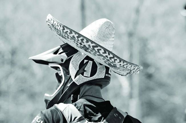 This racer combined some pretty diverse head gear last weekend when at long last the mountain bike trails at Mountain Creek reopened for the season.