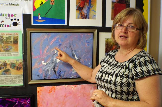 Suzanne Struble of Glen Meadow Middle School describes how Barry Lakes artist Nick Cerrato picks the colors for his paintings.