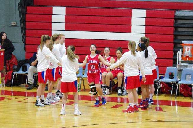 Lenape Valley Patriot Danielle DeMasi slaps the hands of teammates when her name is announced before the start of the game.