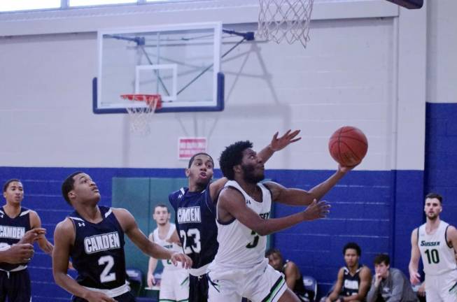 Sussex County's Aalim Jones takes the ball towards the hoop in the first quarter.