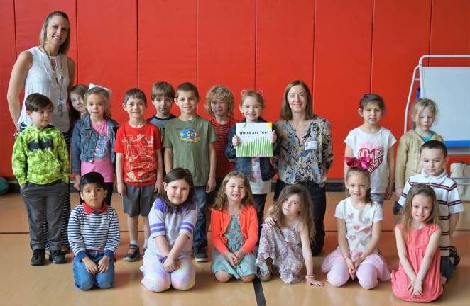 A Kindergarten class poses with author and illustrator Sarah Williamson, kneeling in back row.