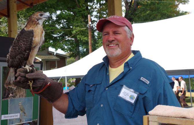 PHOTOS BY CHRIS WYMAN Avian Wildlife Center volunteer Dan Graham of Wantage is shown teaching Wallkill Wildlife Refuge visitors all about this Red Tailed Hawk as the refuge celebrates is 25th anniversary.
