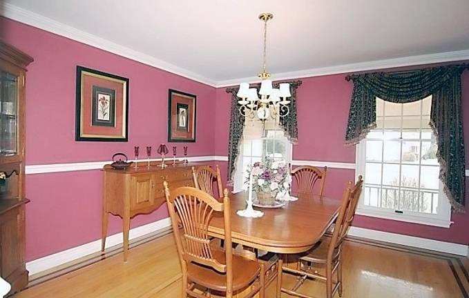 Spacious center hall colonial has in-ground pool