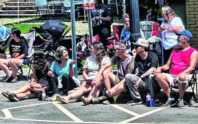 <b>Spectators watch the parade.</b>