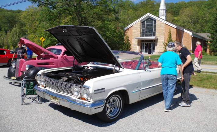 This 1963 Chevrolet Impala convertible was a favorite to visitors. The car&#xfe;&#xc4;&#xf4;s memorabilia included a pair of fuzzy dice and a speaker from a long-ago-closed drive-in theater. The car belongs to Highland Lakes resident Phil Badu.