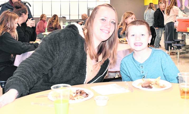 <b>Erica and Layton Kymer of Wantage enjoy breakfast.</b>