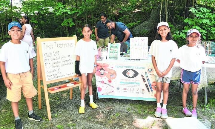 <b>Avyaan Varshney, Myrah Gulati, Sisira Moragudi and Anya Dhebaria, all of Bellemead stand in front of their story, Tiny Traditions.</b>