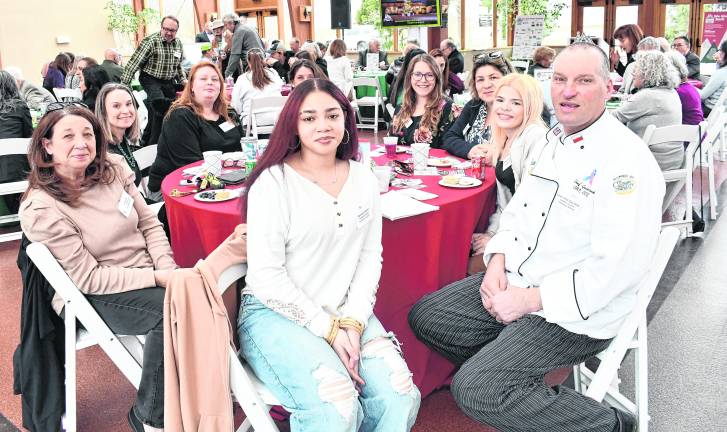 <b>Representatives from Manna House, Samaratin Inn, The Franklin Band and Scout Troop 150 pose for a photo.</b>