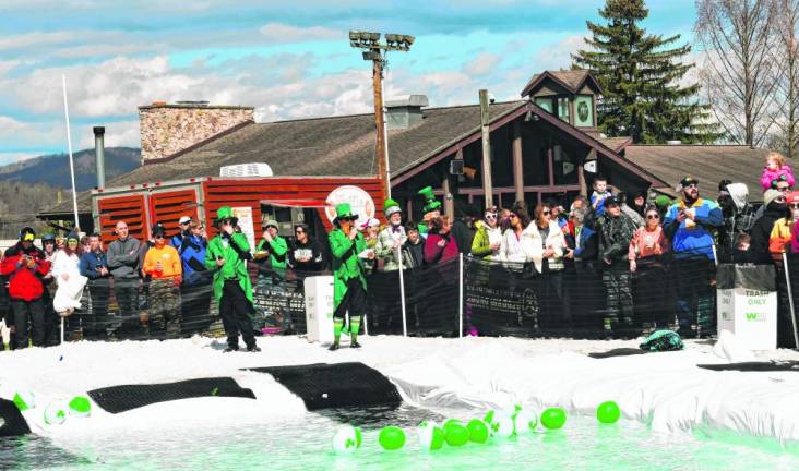 A crowd awaits competitors in the annual Pond Skim at Mountain Creek in Vernon.