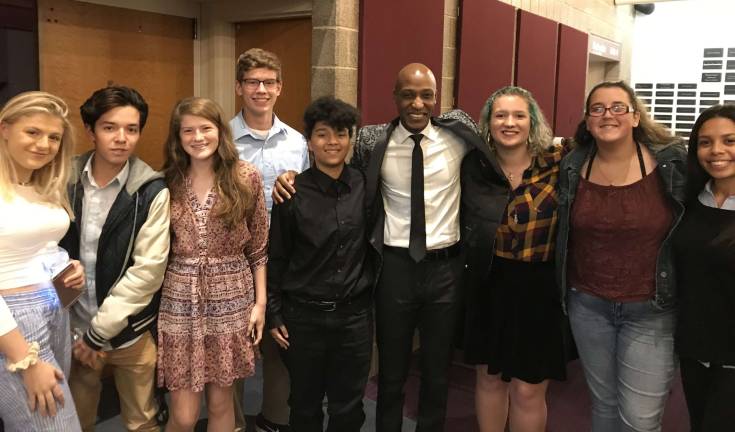 Students from Vernon Township High School attended a special conference on genocide at Raritan Community College. Here, Daniel Trust (center), who survived the Rawandan Genocide, spent time speaking with and taking selfies with the students.