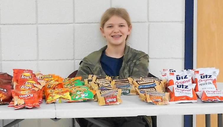 A student hands out snacks.