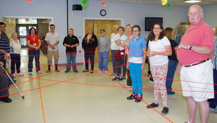 Vernon seniors and students from Glen Meadow School shared goals and experiences through a series of interactive team work exercises. This exercise included tossing a ball of yarn back and forth across the circle creating a &#xfe;&#xc4;&#xfa;dream catcher&#xfe;&#xc4;&#xf9; until there were enough strands to support and keep a balloon from falling to the floor.