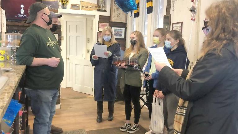 Students read an official Glen Meadow Middle School Proclamation to the Tracks Deli owners (Photo provided)