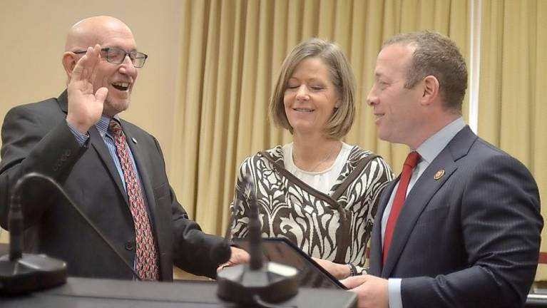 U.S. Rep. Josh Gottheimer swears in Vernon Township Councilman Harry Shortway on Wednesday, Jan. 1, as Shortway's wife, Cherie, holds the bible.