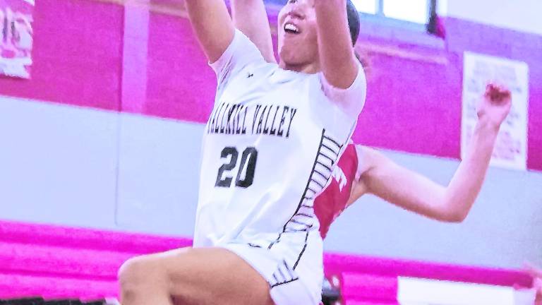 <b>Wallkill Valley's Jordyn Trinkleback (20) leaps during a shot. Trinkleback scored 12 points.</b>