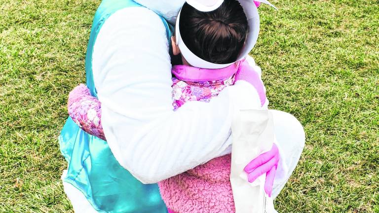 <b>Everleigh Shane hugs the Easter Bunny.</b>