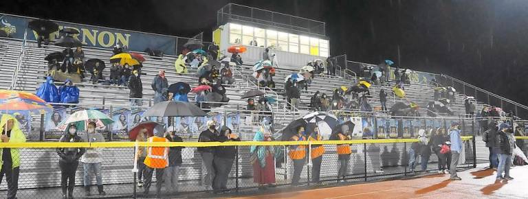 The audience enjoys the half-time show.