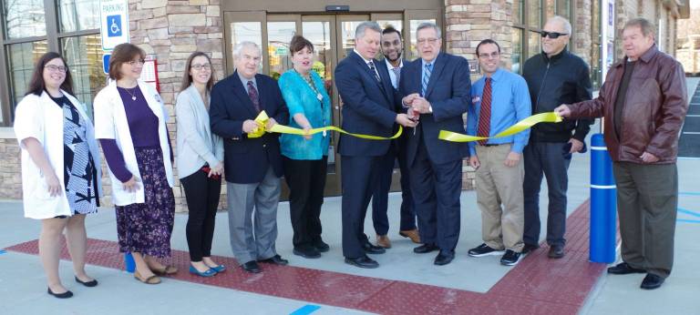 PHOTO BY CHRIS WYMAN The new Vernon CVS opened on Sunday, Dec. 20. At the ribbon cutting ceremony are from left Pharmacy Technician Kara Ruth Shah, Pharmacist-In-Charge Sandra DeBaun, employee Kate Lasorsa, Council President Patrick Rizzuto, Assistant Manager JoAnna Houghtaling, CVS District Manager Michael Stenderowicz, Pharmacy Supervisor Jinesh Patel, Mayor Victor Marotta, Branch Manager Mike Zanella, Bruce Zaretsky, and Councilman Dick Wetzel.