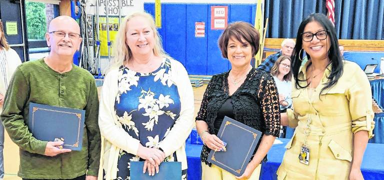 <b>Vernon Township Superintendent Eveny de Mendez, right, stands with the district’s 25-year employees.</b>