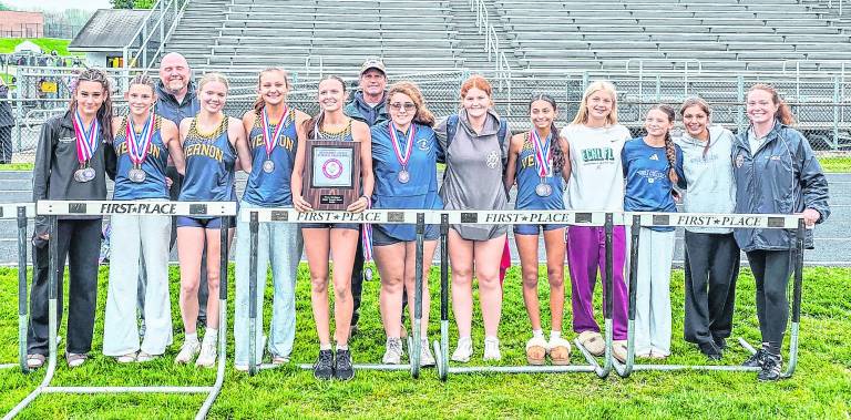 <b>The Vernon Township girls’ track team is shown with the NJAC championship plaque.</b>