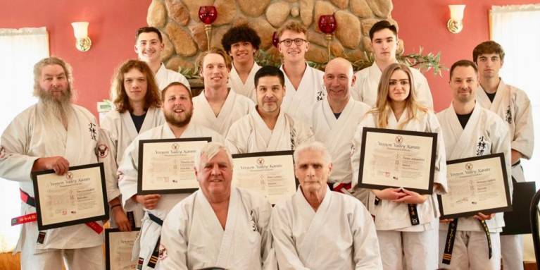 In front row are Sensei Tom Shull, left, and Sensei Chuck Ercolano. In middle row, from left, are Tim Duvelsdorf, Connor Shillcock, Timmy Duvelsdorf, Paul Doumanis Jr., Jose Gomez, Paul Doumanis, Taylor Schoenfeld and Nick Vigiletti. In back row, from left, are Jake Remington, Eric Rosario, Cody Williams, Scott Wolven and Wade Riley. (Photo provided)