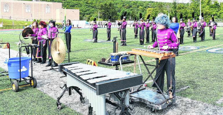 The Newton High School Marching Band performs.