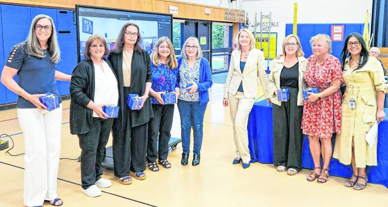 <b>Vernon Township School District retirees stand with Board of Education President Jennifer Pellet and Superintendent Eveny de Mendez.</b>