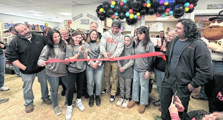 The ribbon is cut on the new facility for Benny’s Bodega in Augusta.