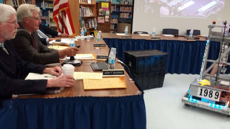 Photos by Jennifer Knocha Vernon Township School District Board of Education member Ed Gilson tries driving a robot built by the Vernon Township High School Robotics team.