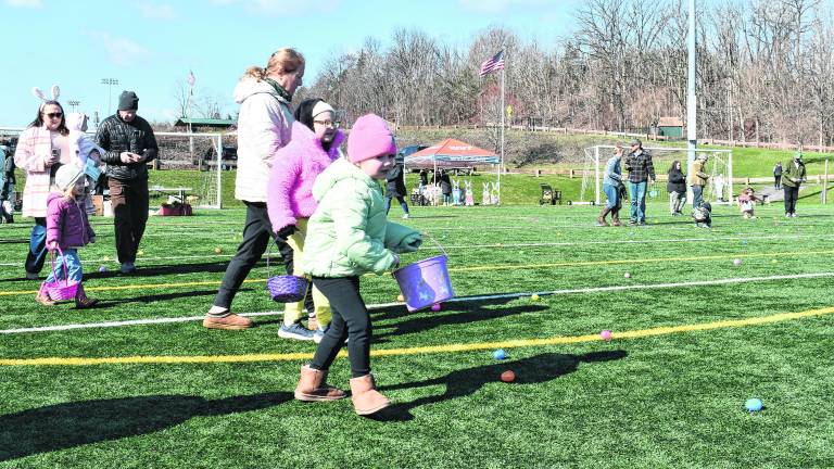 <b>Children hunt for Easter Eggs at Maple Grange Park in Vernon Township.</b>