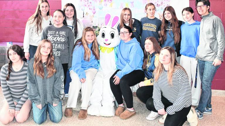 <b>The Vernon Softball team poses iwth the Easter Bunny.</b>