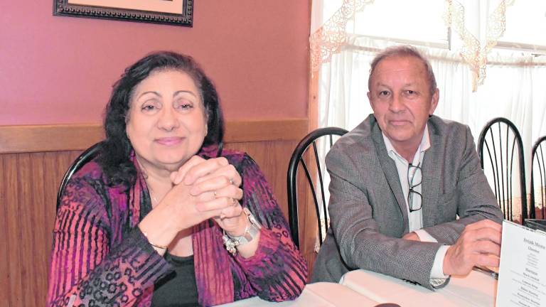 <b>Teri DeGroat, a broker from Weichert Realtors and Bob Eaton (vice president of the Weichert Office in Hamburg, pose for a photo.</b>