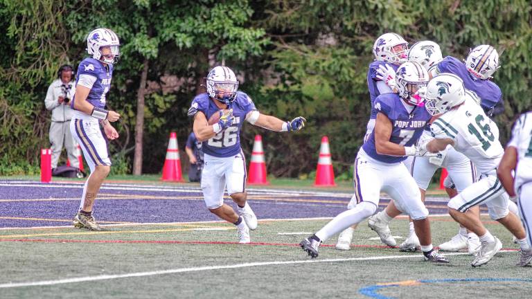 <b>PJ1 Pope John running back Luke Gialanella carries the ball in the season opener against DePaul on Saturday, Aug. 30. DePaul won, 31-3. (Photo by George Leroy Hunter)</b>