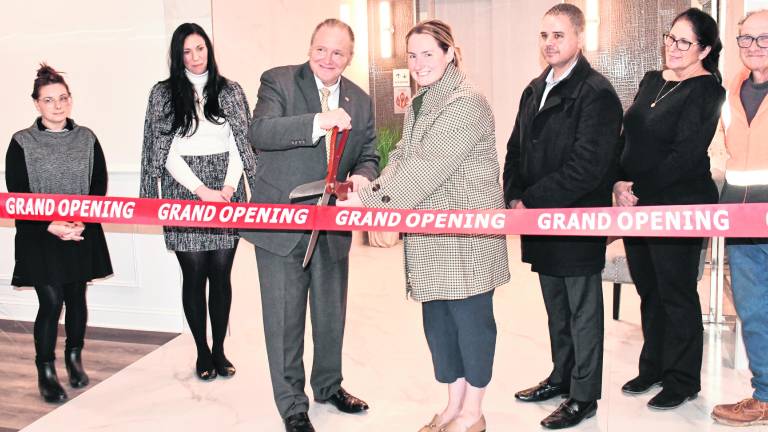 <b>Vernon Township Mayor Anthony Rossi cuts the ribbon on a 55-plus rental community.</b>
