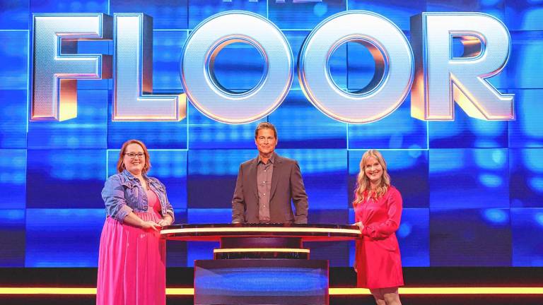 Jeorgi Smith, right, competes on season three of ‘The Floor,’ a game show hosted by Rob Lowe, center, on Fox. (Photos provided)