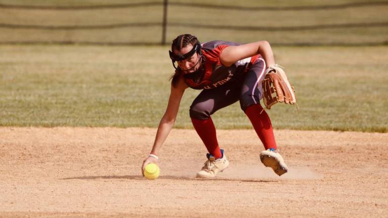 HP1 High Point freshman Joelle Lucatorto scoops up the ball in the game against Jefferson on Friday, June 2. (Photos by Jay Vogel)