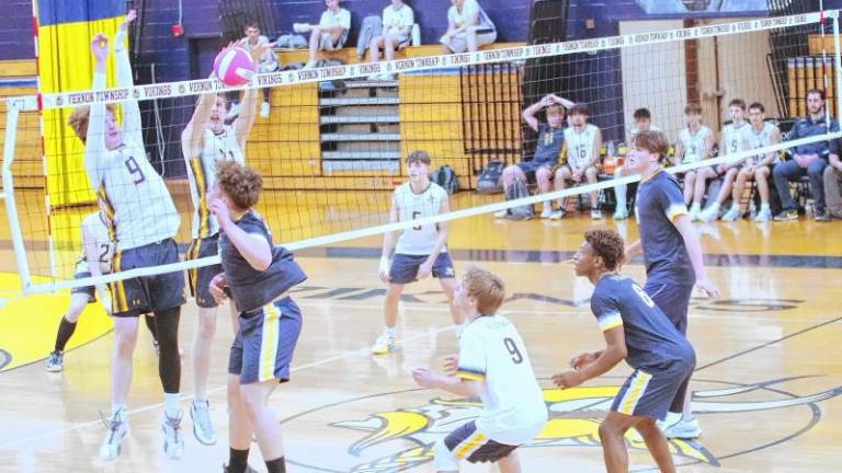 <b>VK1 The Vikings and Falcons battle on the volleyball court Wednesday, April 23. Vernon won, 2-1. (Photos by George Leroy Hunter)</b>