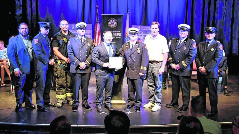 <b>Gottheimer presents awards to local heroes and their families.</b>