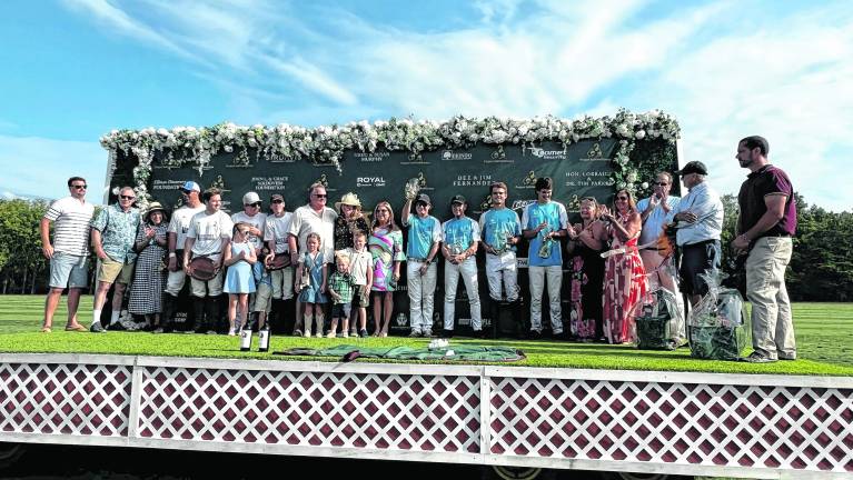 <b>First Hope Bank and Lakeside Construction celebrated their tying score at the Project Self-Sufficiency Fall Polo Classic which was held at the Grayfields Polo Club in Allamuchy.</b>