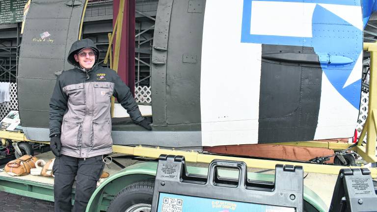 <b>Matt Susko stands in front of a S-47 Skytrain D-Display.</b>