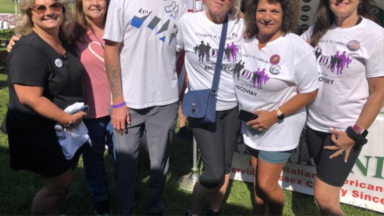 From left are Nancy Bolton, Donna Rowan, Mark Lindsay Jr., Laurie Lydecker, Elaine Tizzano and Liz Carroll. The friends of Tizzano, a founder of the walk, have been part of it since the first year.