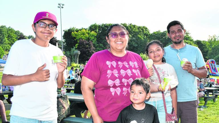 <b>Ernique, Lizbeth, Saul Jr., Gabriella and Saul of Newton pose for a photo.</b>