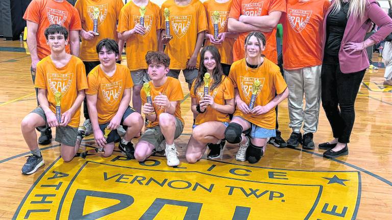 <b>Members of the Vernon PAL Co-Ed Grades 6–8 basketball team celebrate after winning the league championship game March 5 at the Vernon PAL building. The team captured the title following a hard-fought season in the local youth league.</b>