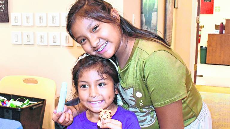<b>Citlali and Cailtin Contreras of Hackettstown pose for a photo.</b>