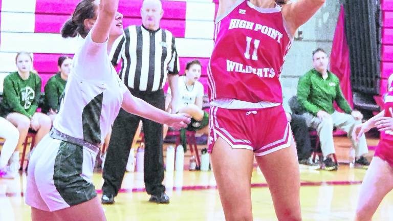 <b>High Point's Daphne Mathews (11) is in the midst of a shot. Mathews scored 2 points.</b>